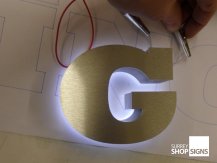 G brushed letters halo