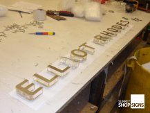 clear perspex and gold letters