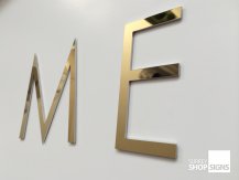 polished gold ME letters